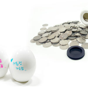 egg shaped coin bank and coins