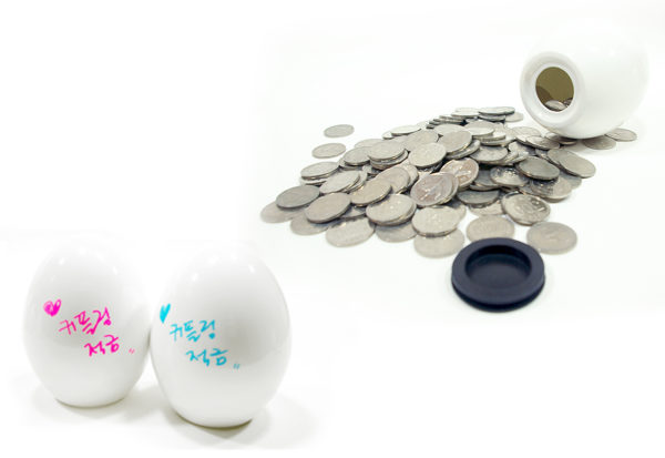 egg shaped coin bank and coins